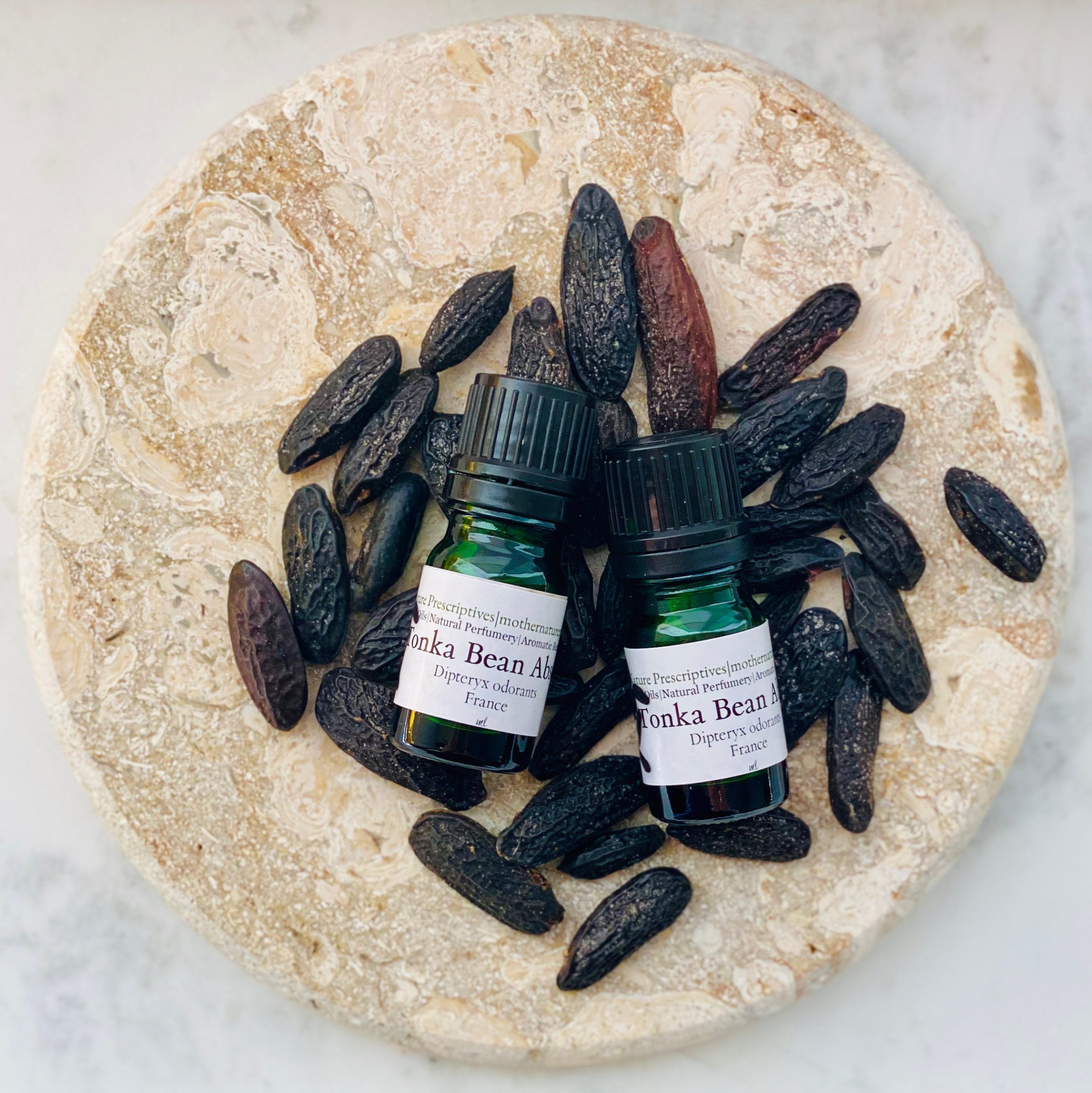 Essential oil made from Tonka beans Stock Photo by picturepartners